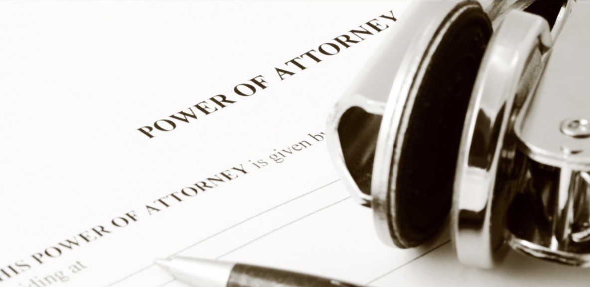 Notary stamp beside a power of attorney document